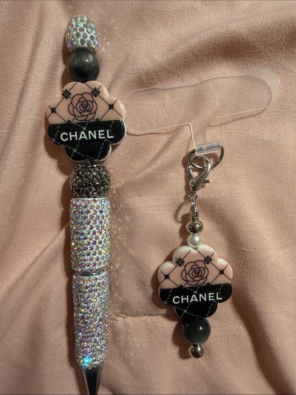 Silver rhinestone pen and matching phone charm with attachment.